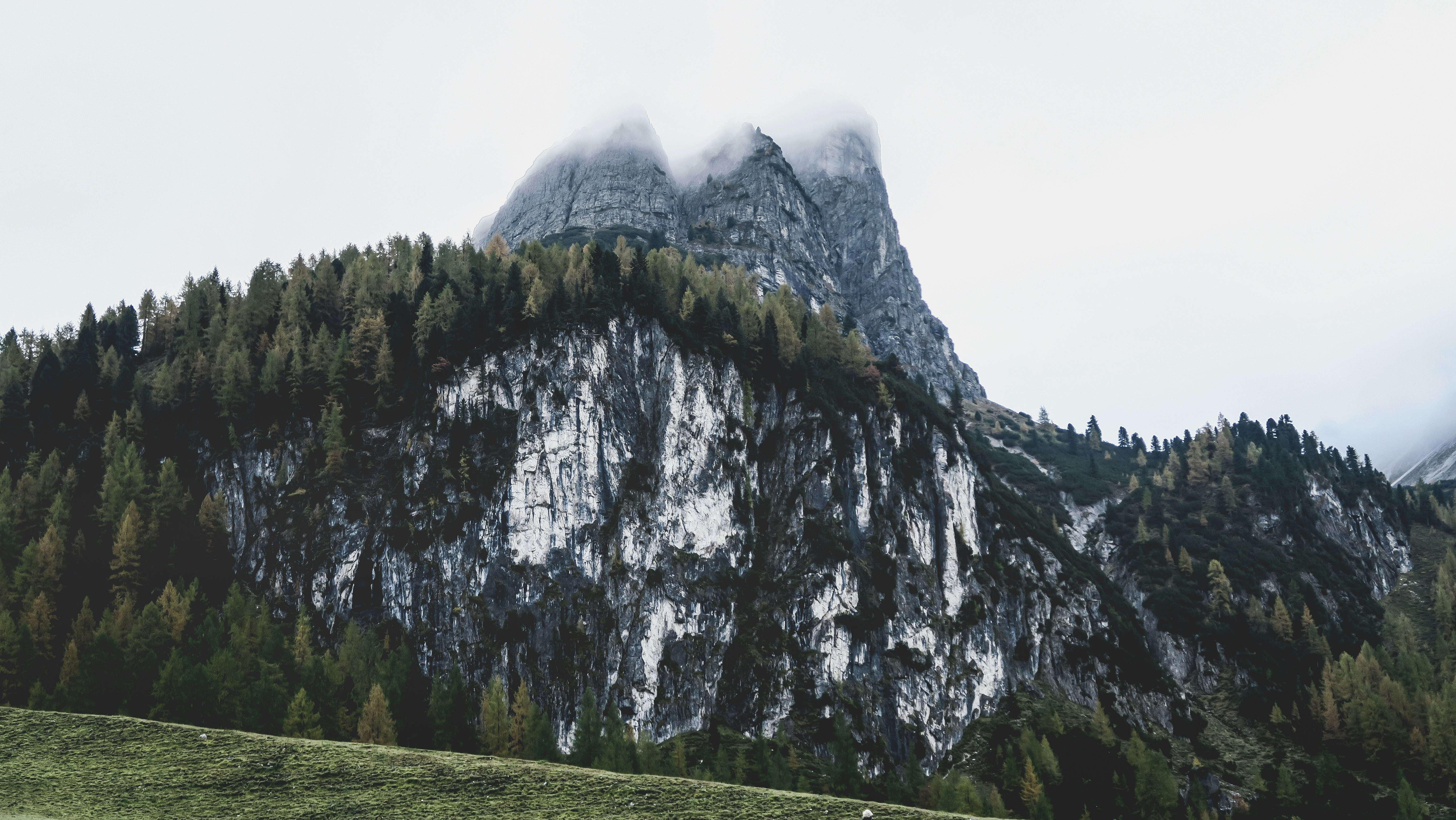 green and white mountain under white sky during daytime